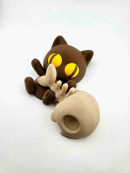 Liegende Katze mit Fischgrete